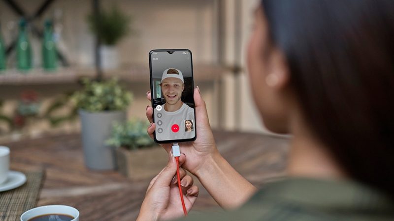 a woman making a video call on a OnePlus smartphone